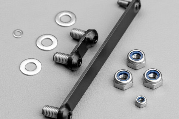 The unit features a polycarbonate lens; a powder-coated, extruded aluminium body with pressure die-cast end caps; and moulded polycarbonate covers, hard-coated for scratch and UV resistance.