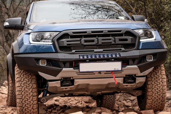 spiritual ties to the USA's Ford F-150 Raptor, has very distinctive eye-catching styling, from its blocky front grille (with all-capped FORD letters in your face), past meaty shoulders, flared wheelarches, beefy diecast magnesium side-steps, and chunky BFG All Terrain tyres, all the way back to the business end.